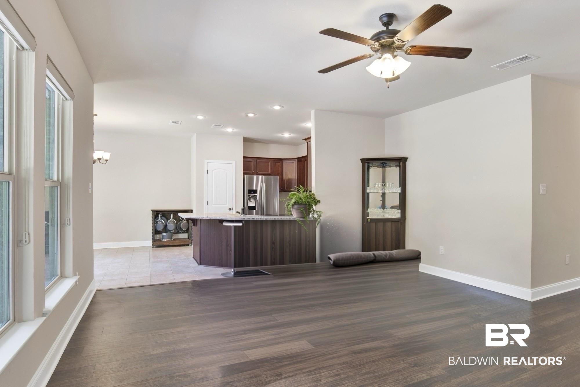 21282 Merlot Loop Silverhill, AL 36576 - Photo 9 of 27 Kitchen with a breakfast bar area, stainless steel fridge, light wood-type flooring, and ceiling fan