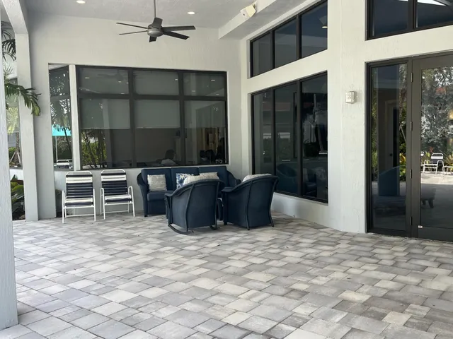 a room with furniture a flat screen tv and outdoor seating