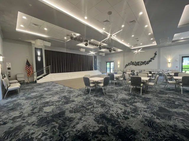 a large room with lots of chairs and mirrors