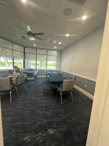 a room with lots of wooden furniture and a view of dining room
