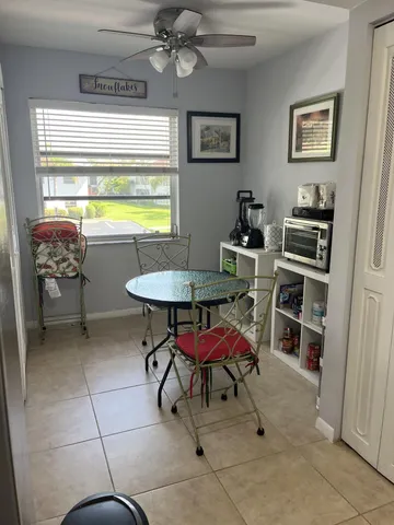 a workspace with furniture and a window