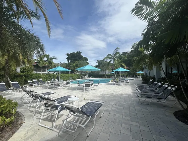 a view of a swimming pool and lounge chair