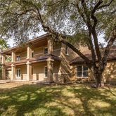 a view of a large building with large trees