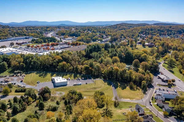 an aerial view of a house with a yard lake view