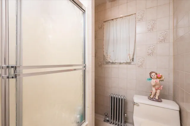a bathroom with a shower and a tub