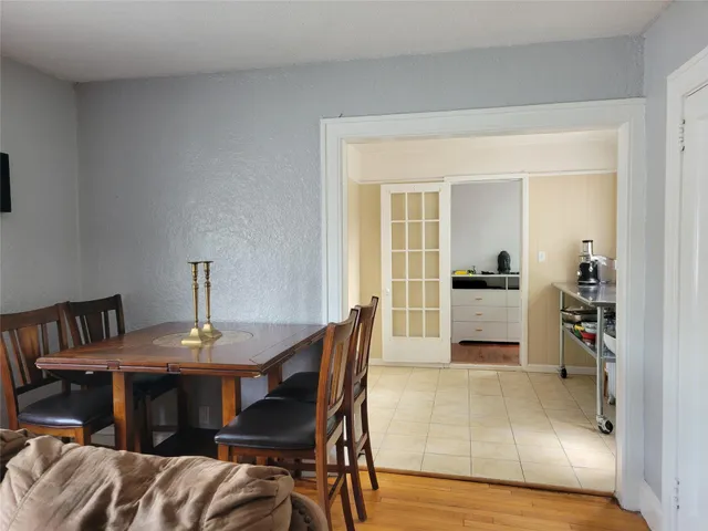a view of a dining room with furniture and a livingroom