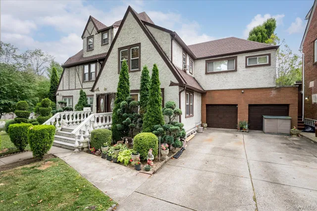 a front view of a house with garden