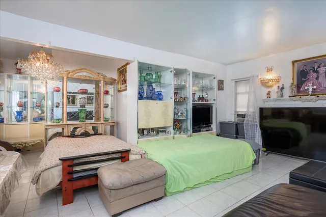 a bedroom with furniture and a fireplace