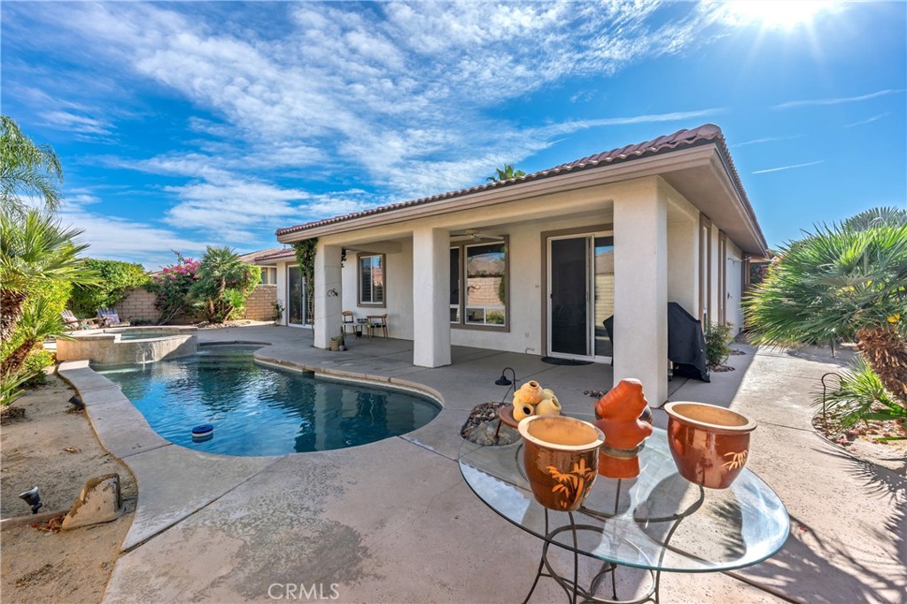 241 Via Martelli Rancho Mirage, CA 92270 - Photo 1 of 37 a view of a patio with swimming pool table and chairs