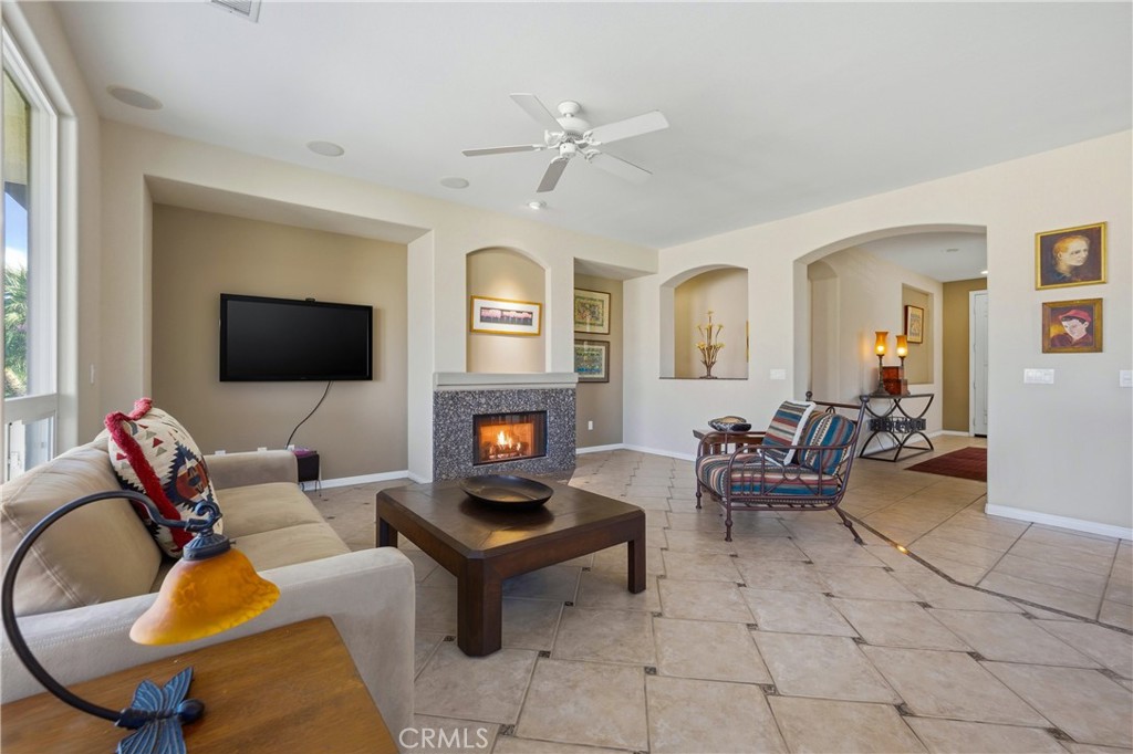 241 Via Martelli Rancho Mirage, CA 92270 - Photo 11 of 37 a living room with furniture and a flat screen tv