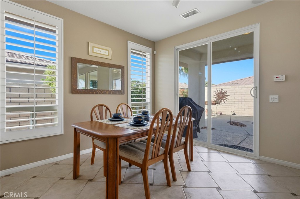 241 Via Martelli Rancho Mirage, CA 92270 - Photo 16 of 37 a dining room with furniture and window