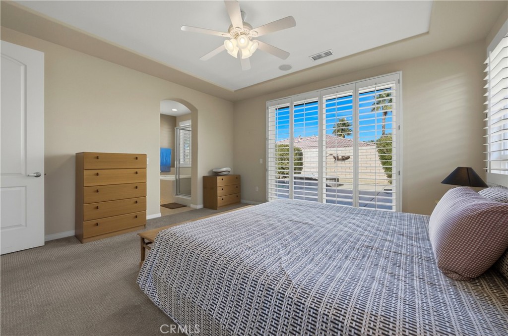 241 Via Martelli Rancho Mirage, CA 92270 - Photo 20 of 37 a bedroom with a bed and a dresser