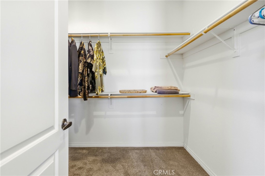 241 Via Martelli Rancho Mirage, CA 92270 - Photo 22 of 37 a view of walk in closet with clothes