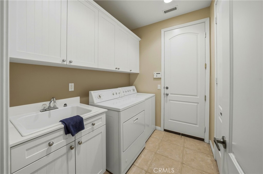 241 Via Martelli Rancho Mirage, CA 92270 - Photo 25 of 37 a utility room with dryer and washer