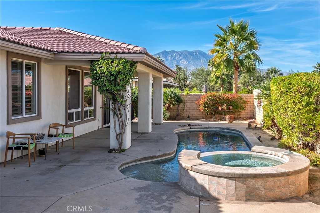 241 Via Martelli Rancho Mirage, CA 92270 - Photo 3 of 37 a view of a house with backyard and sitting area