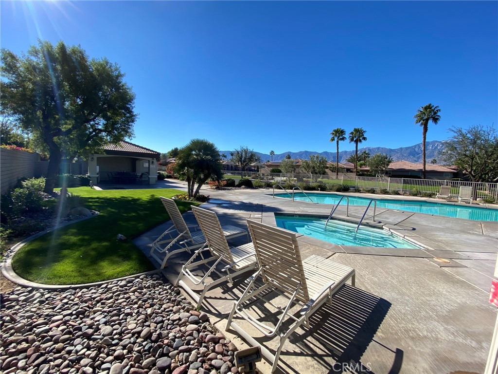 241 Via Martelli Rancho Mirage, CA 92270 - Photo 35 of 37 a view of a swimming pool with a patio