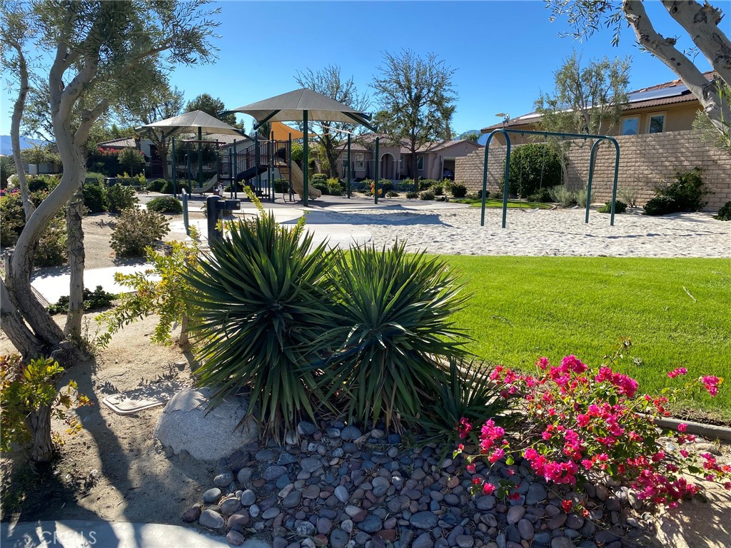 241 Via Martelli Rancho Mirage, CA 92270 - Photo 36 of 37 a view of a house with a yard and sitting area
