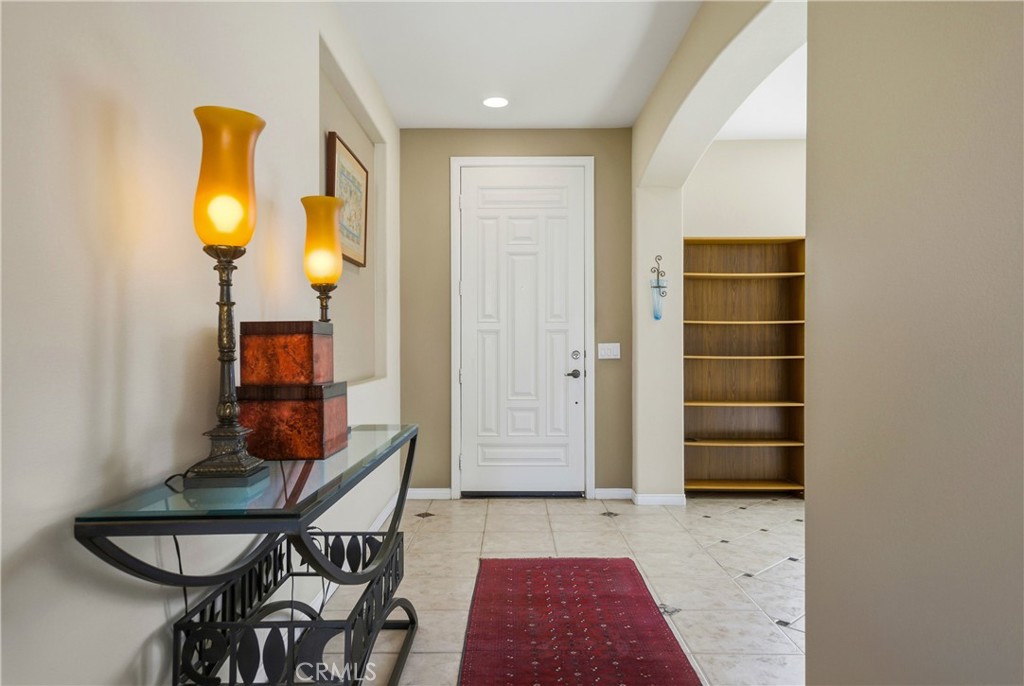 241 Via Martelli Rancho Mirage, CA 92270 - Photo 6 of 37 a view of a livingroom with furniture and wooden floor