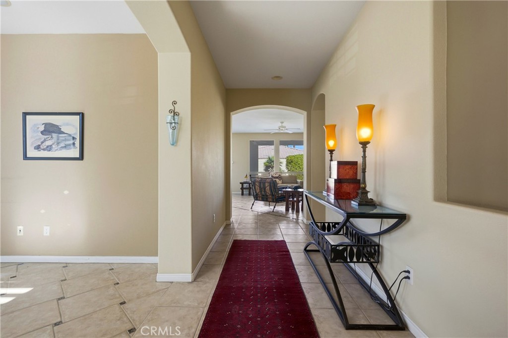 241 Via Martelli Rancho Mirage, CA 92270 - Photo 7 of 37 a view of a hallway with furniture and a rug
