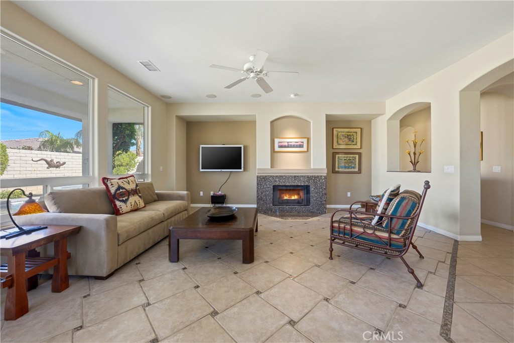 241 Via Martelli Rancho Mirage, CA 92270 - Photo 10 of 37 a living room with furniture and a flat screen tv