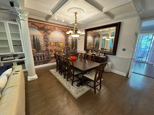a view of entryway with wooden floor