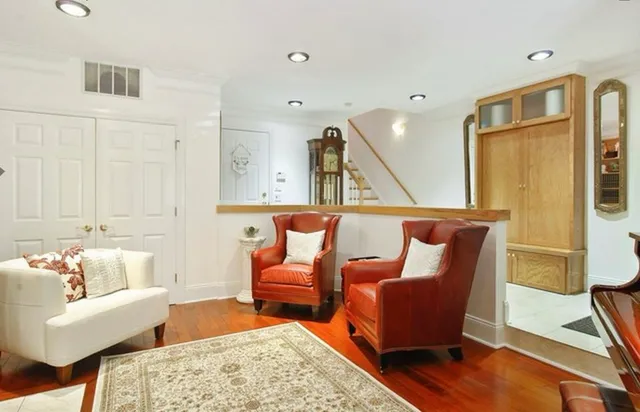 a living room with furniture and a rug