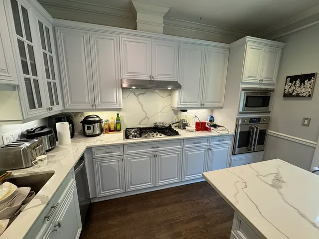 a view of a chairs and table in the balcony