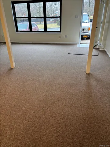 a sign that is in front of flowers