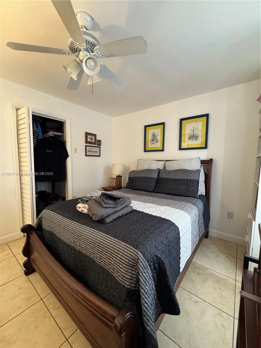15480 Southwest 82nd Lane, Unit 228 Miami, FL 33193 - Photo 15 of 18 a bedroom with a bed and dresser