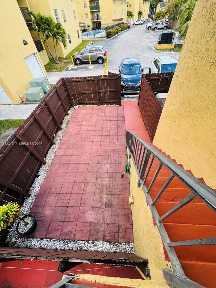 15480 Southwest 82nd Lane, Unit 228 Miami, FL 33193 - Photo 16 of 17 Private Patio / assigned parking in front of unit