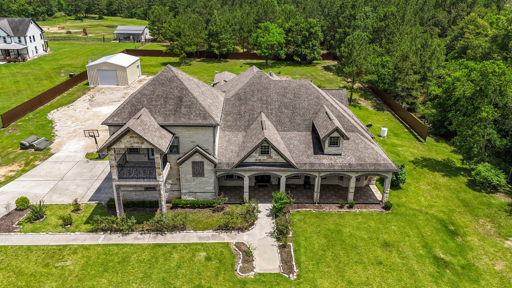 21038 Angus Drive Cleveland, TX 77328 - Photo 5 of 49 a aerial view of a house with a big yard and potted plants