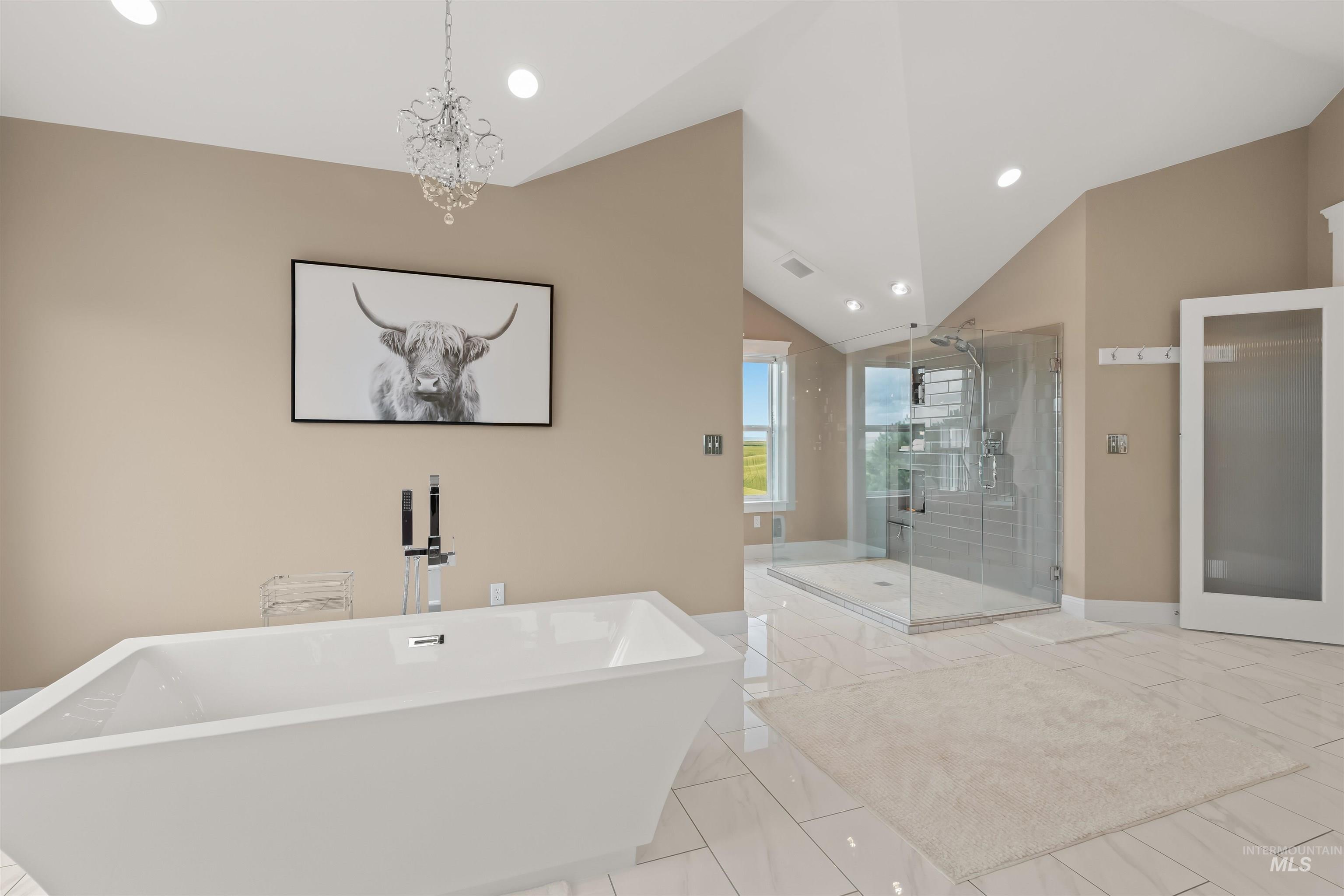 1513 Uniontown Road Genesee, ID 83832 - Photo 7 of 50 Vaulted ceilings with expansive windows and a chandelier