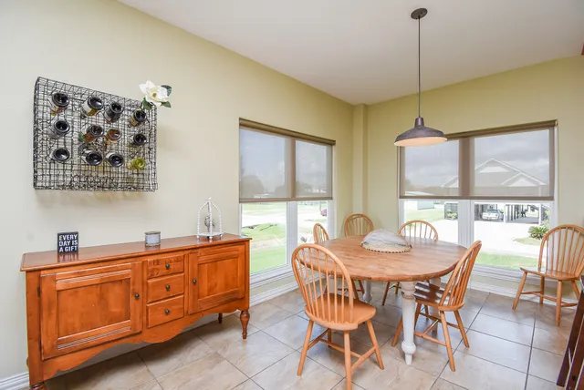 a dining room with furniture and window