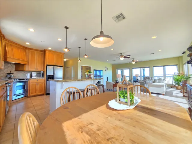 a view of a kitchen and dining area