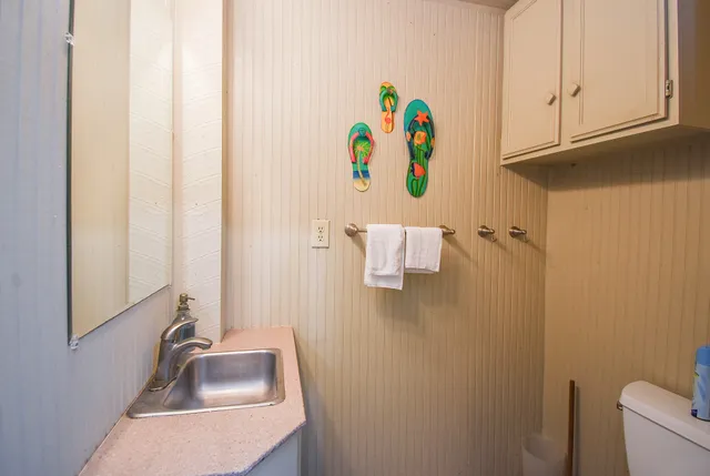 a bathroom with a sink and vanity