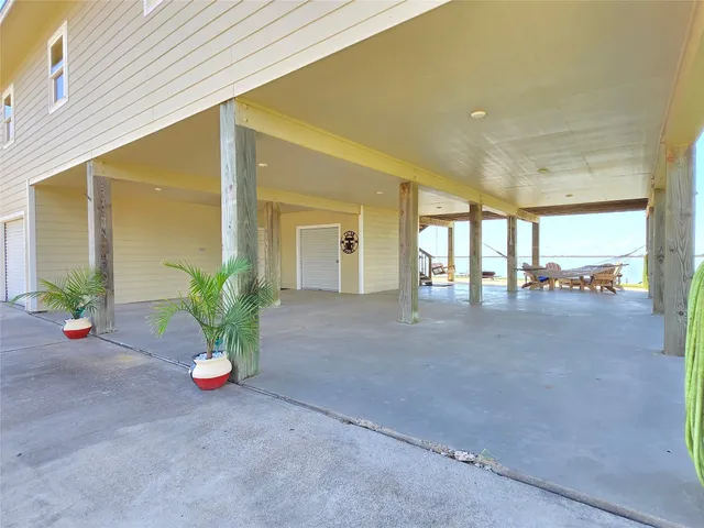 a view of an empty room and a potted plant