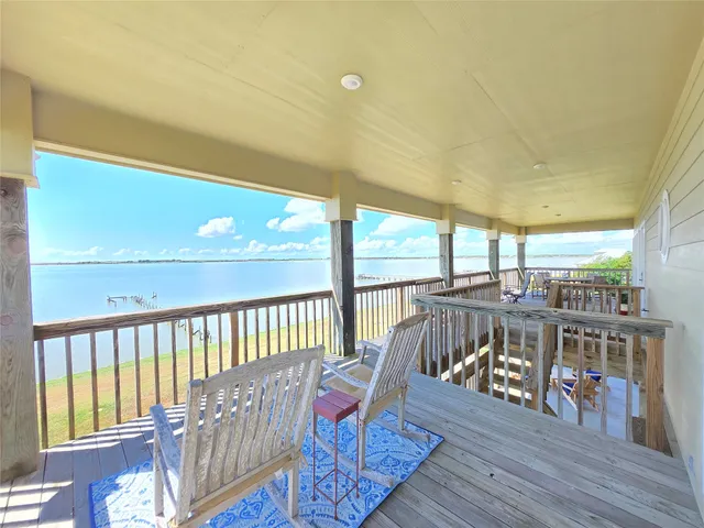 a view of a balcony with furniture