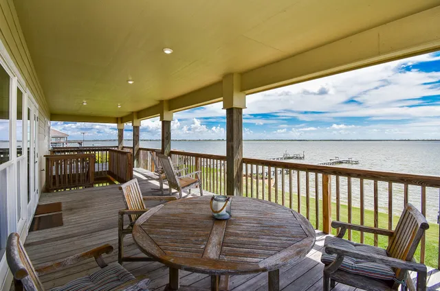 a view of a chairs and table in patio