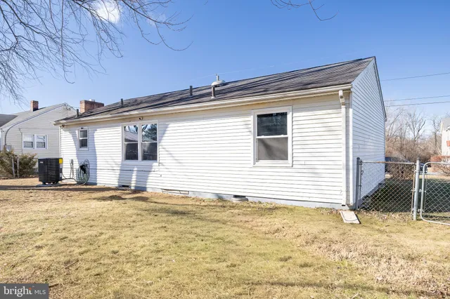 a view of yard with swimming pool and trees