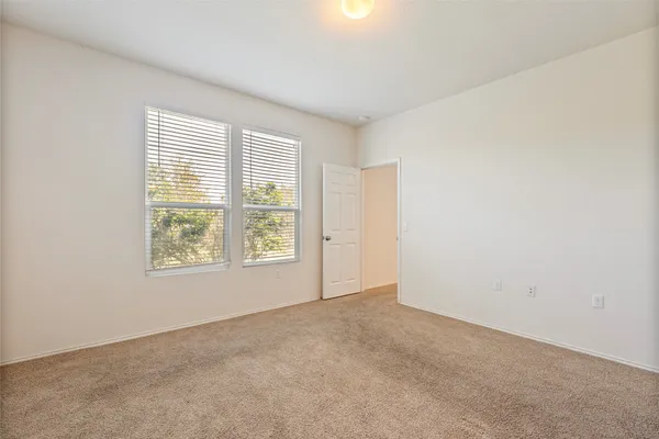 a view of an empty room and window