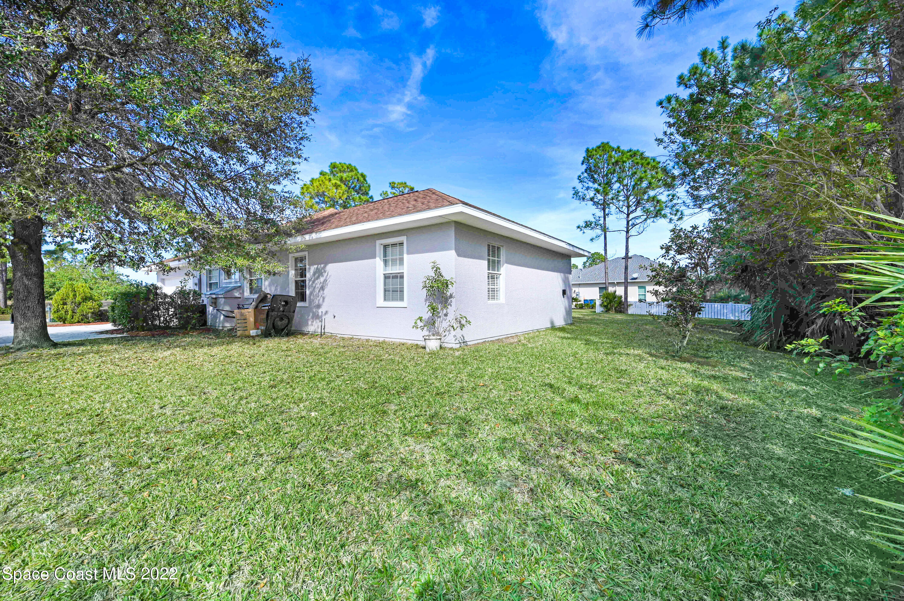 2185 Windbrook Drive Palm Bay, FL 32909 - Photo 16 of 61 a view of a backyard with a garden