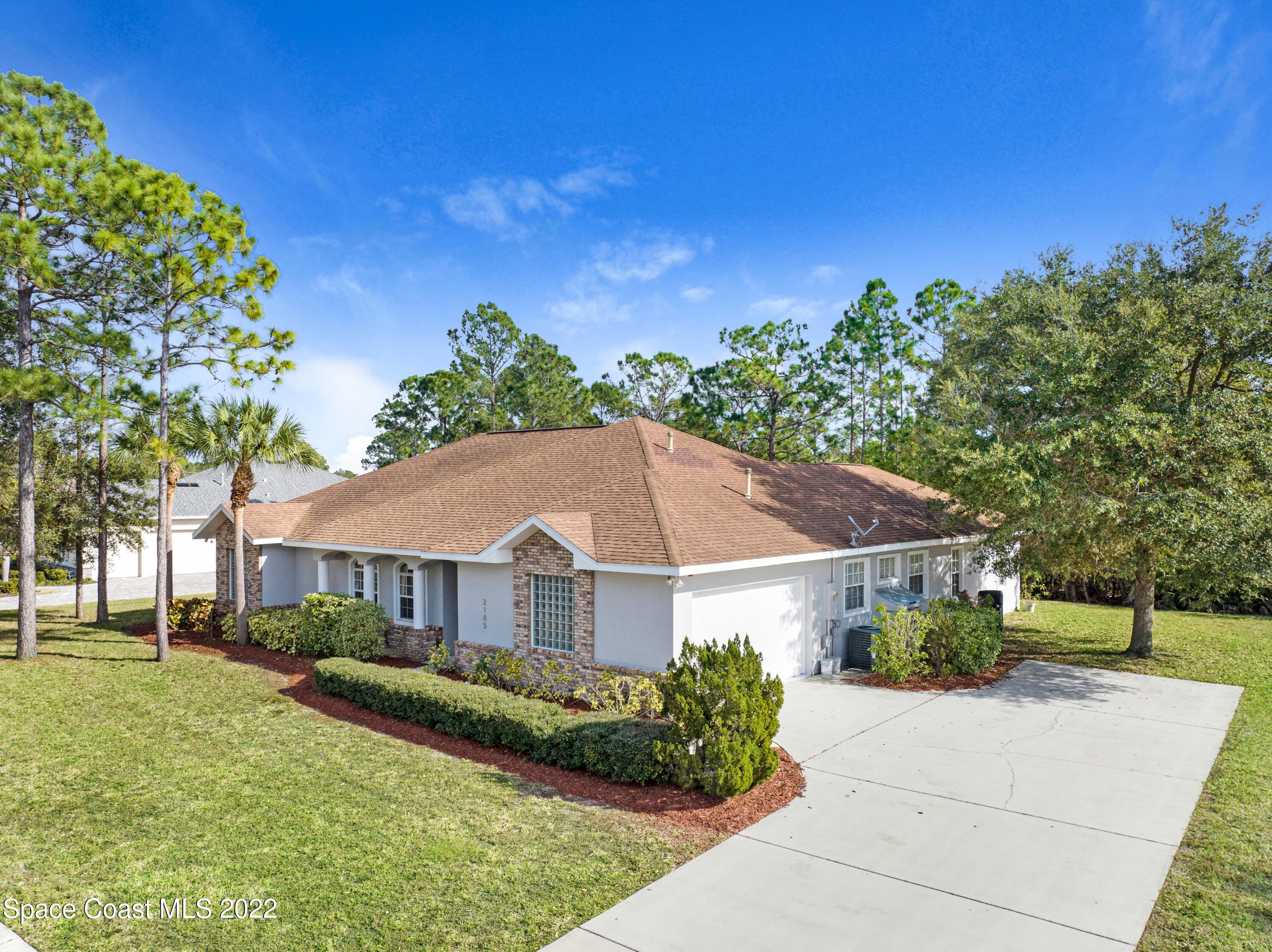 2185 Windbrook Drive Palm Bay, FL 32909 - Photo 2 of 61 a view of house with garden