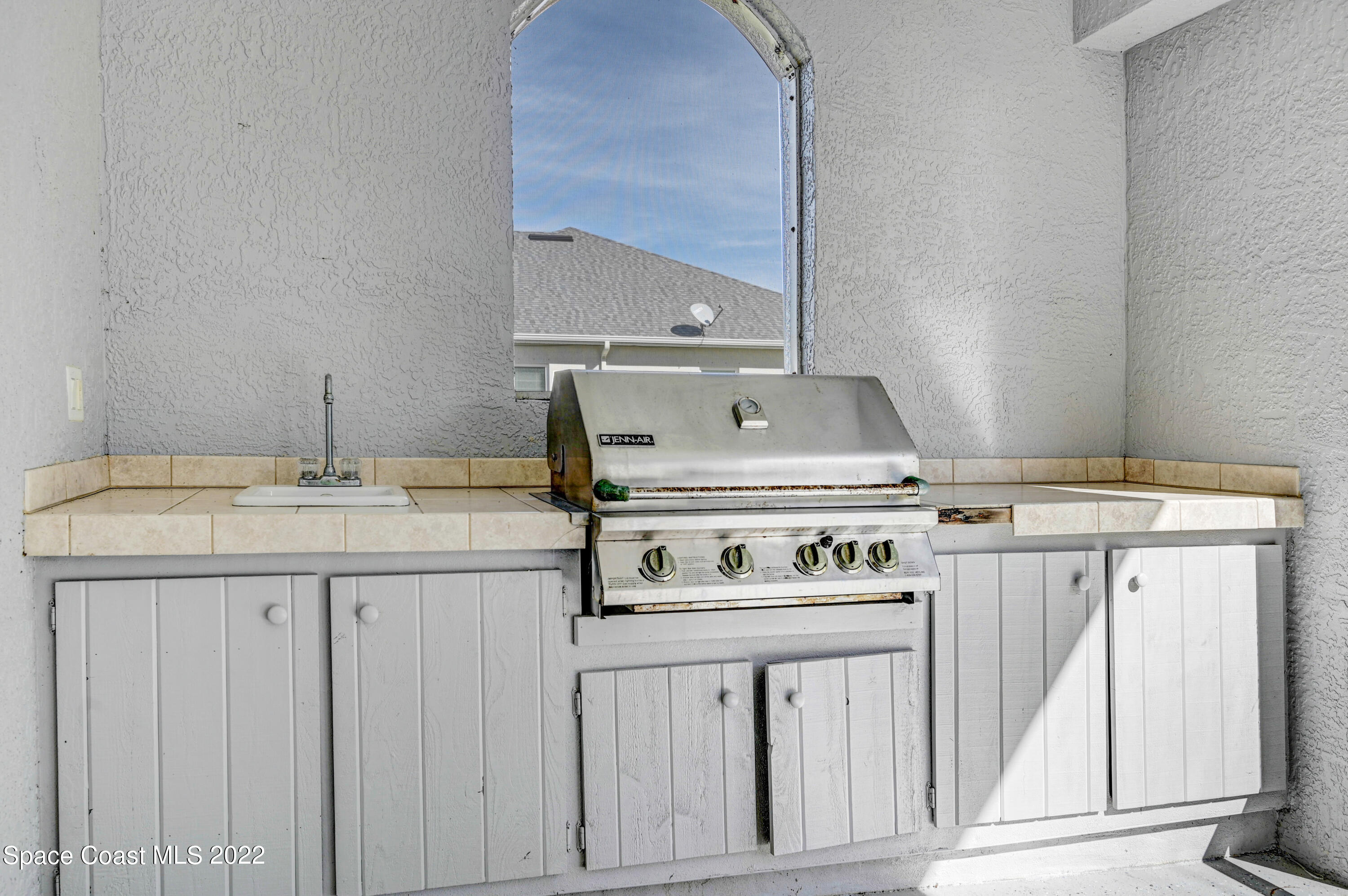 2185 Windbrook Drive Palm Bay, FL 32909 - Photo 21 of 61 a bathroom with a sink and a mirror