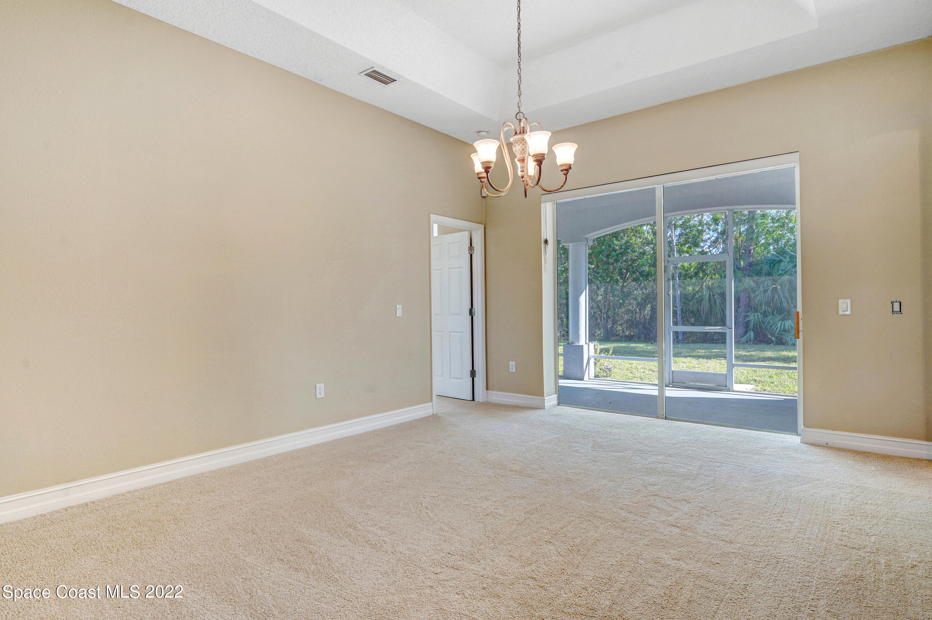 2185 Windbrook Drive Palm Bay, FL 32909 - Photo 29 of 61 a view of an empty room with a window