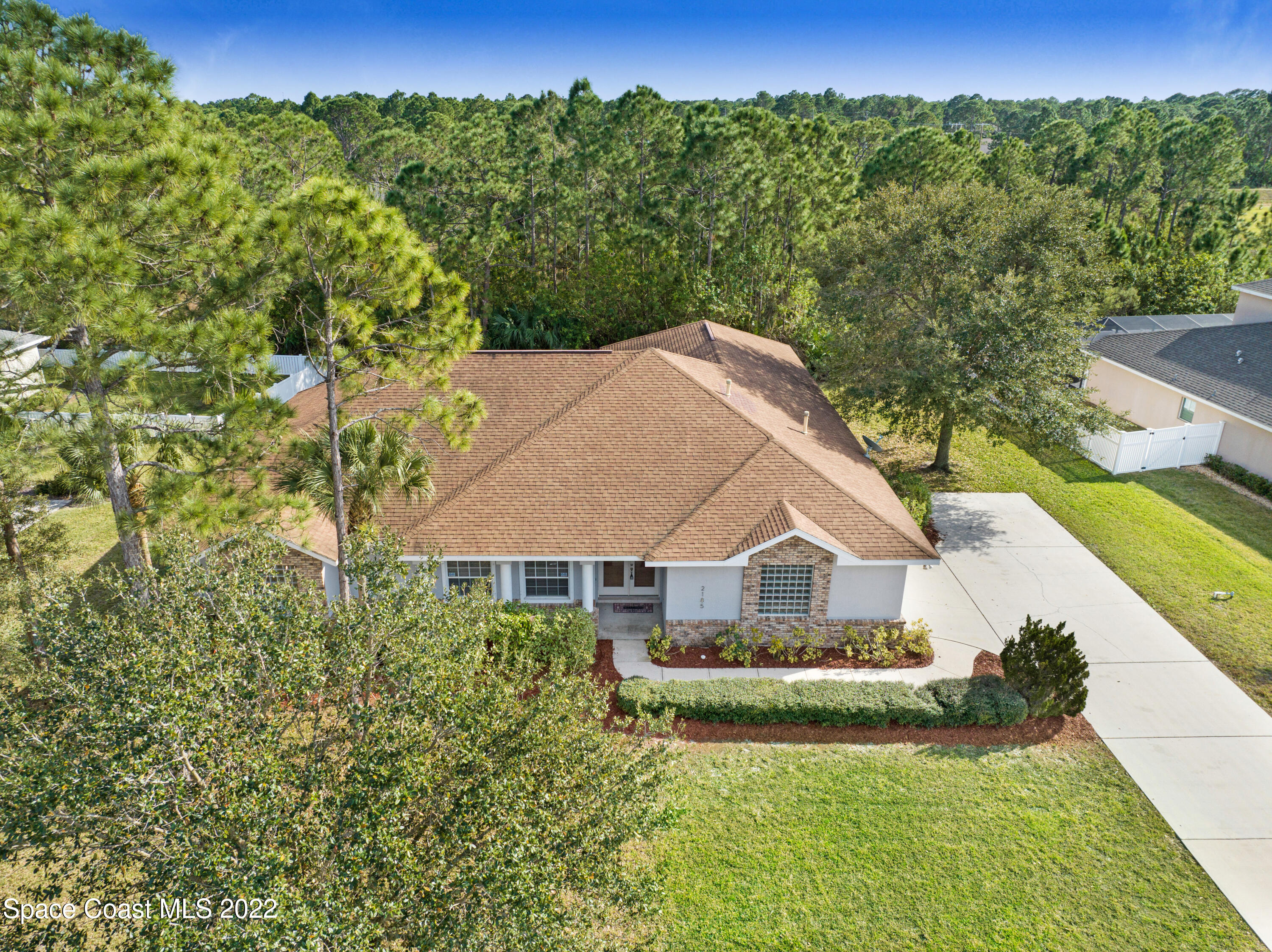 2185 Windbrook Drive Palm Bay, FL 32909 - Photo 3 of 61 a view of a house with a yard