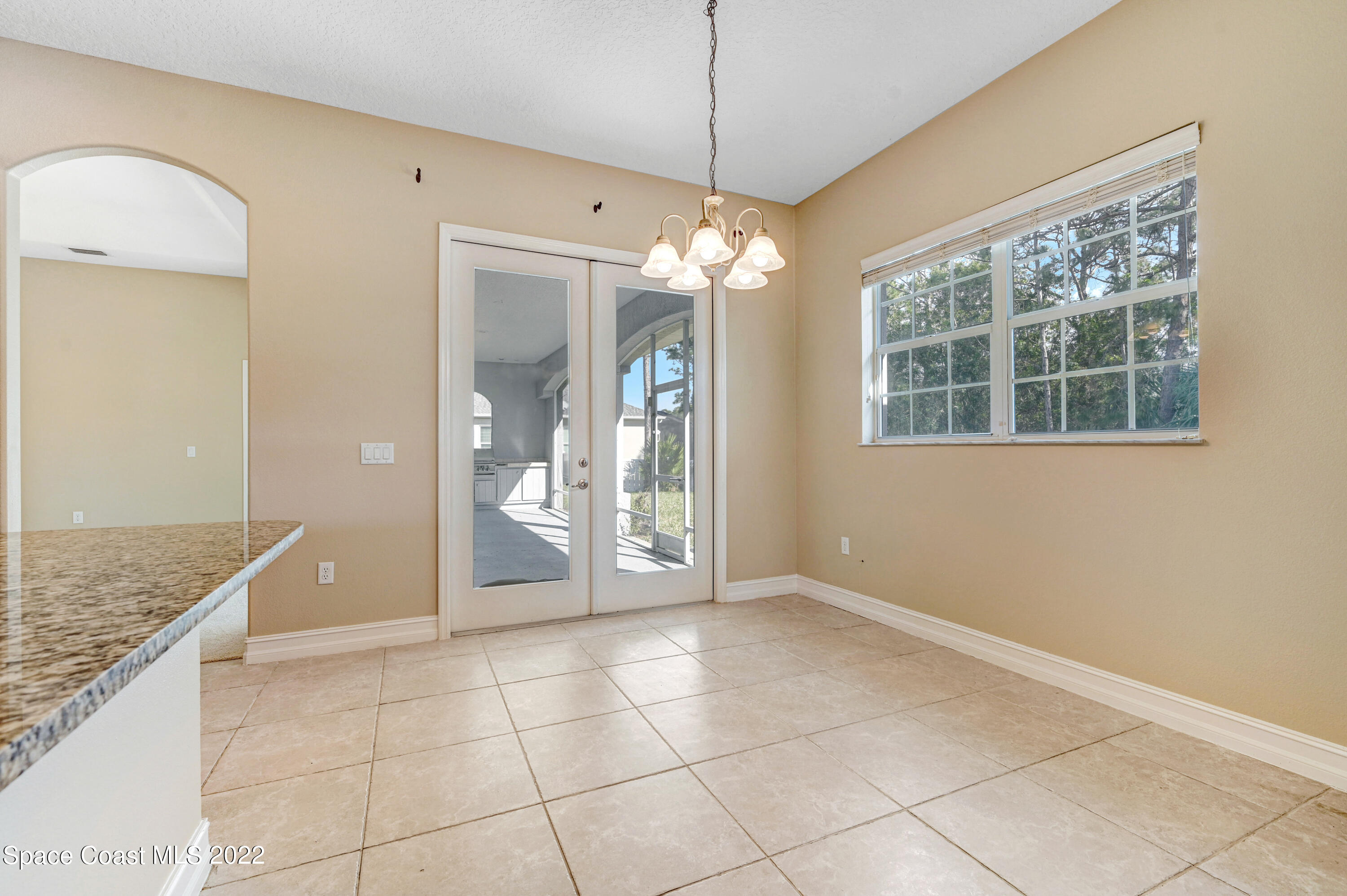 2185 Windbrook Drive Palm Bay, FL 32909 - Photo 34 of 61 a view of a bathroom with a granite countertop sink a mirror and a shower