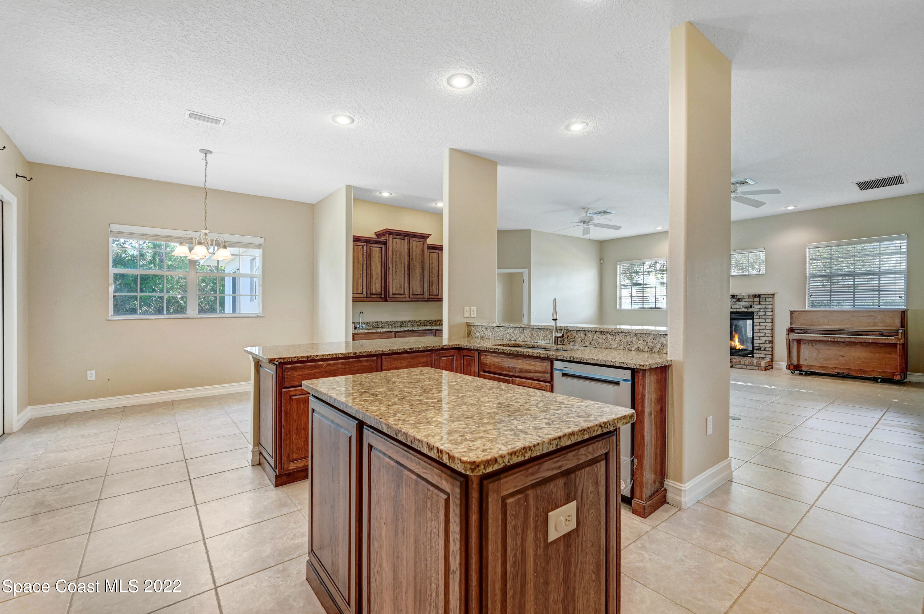 2185 Windbrook Drive Palm Bay, FL 32909 - Photo 39 of 61 a kitchen with granite countertop a sink and a stove