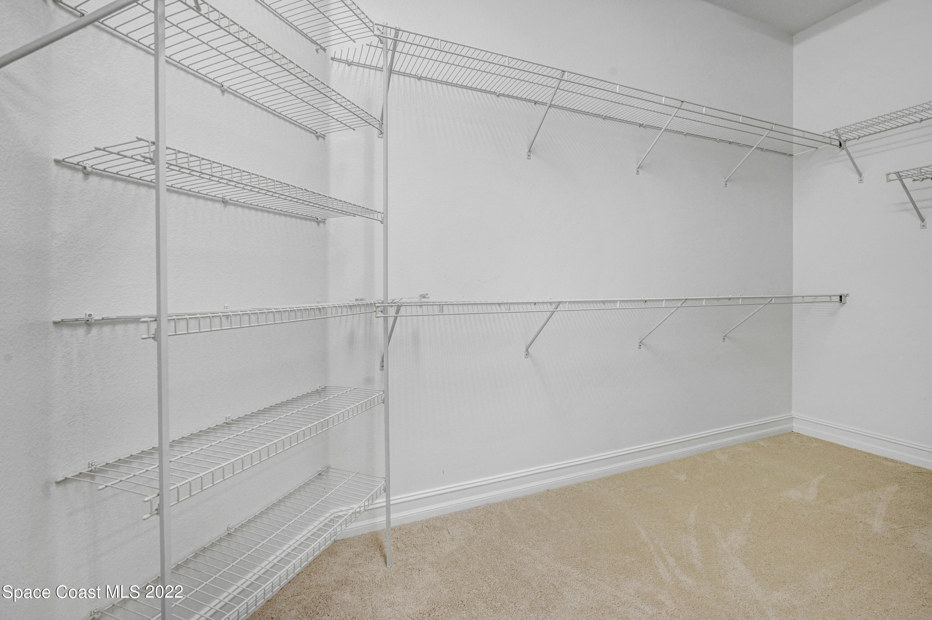 2185 Windbrook Drive Palm Bay, FL 32909 - Photo 52 of 61 a view of an empty walk in closet