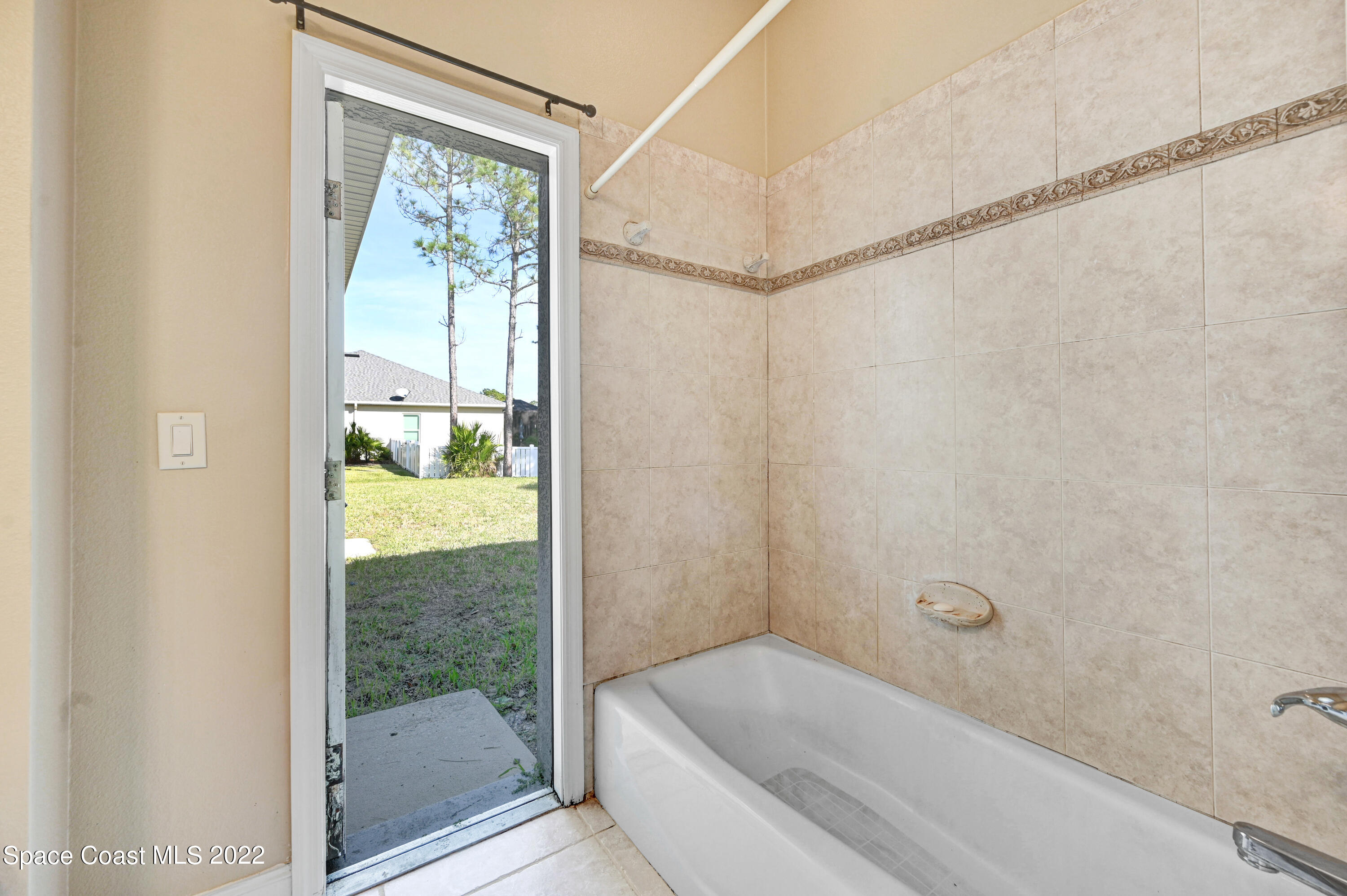 2185 Windbrook Drive Palm Bay, FL 32909 - Photo 57 of 61 a bathroom with a tub and shower