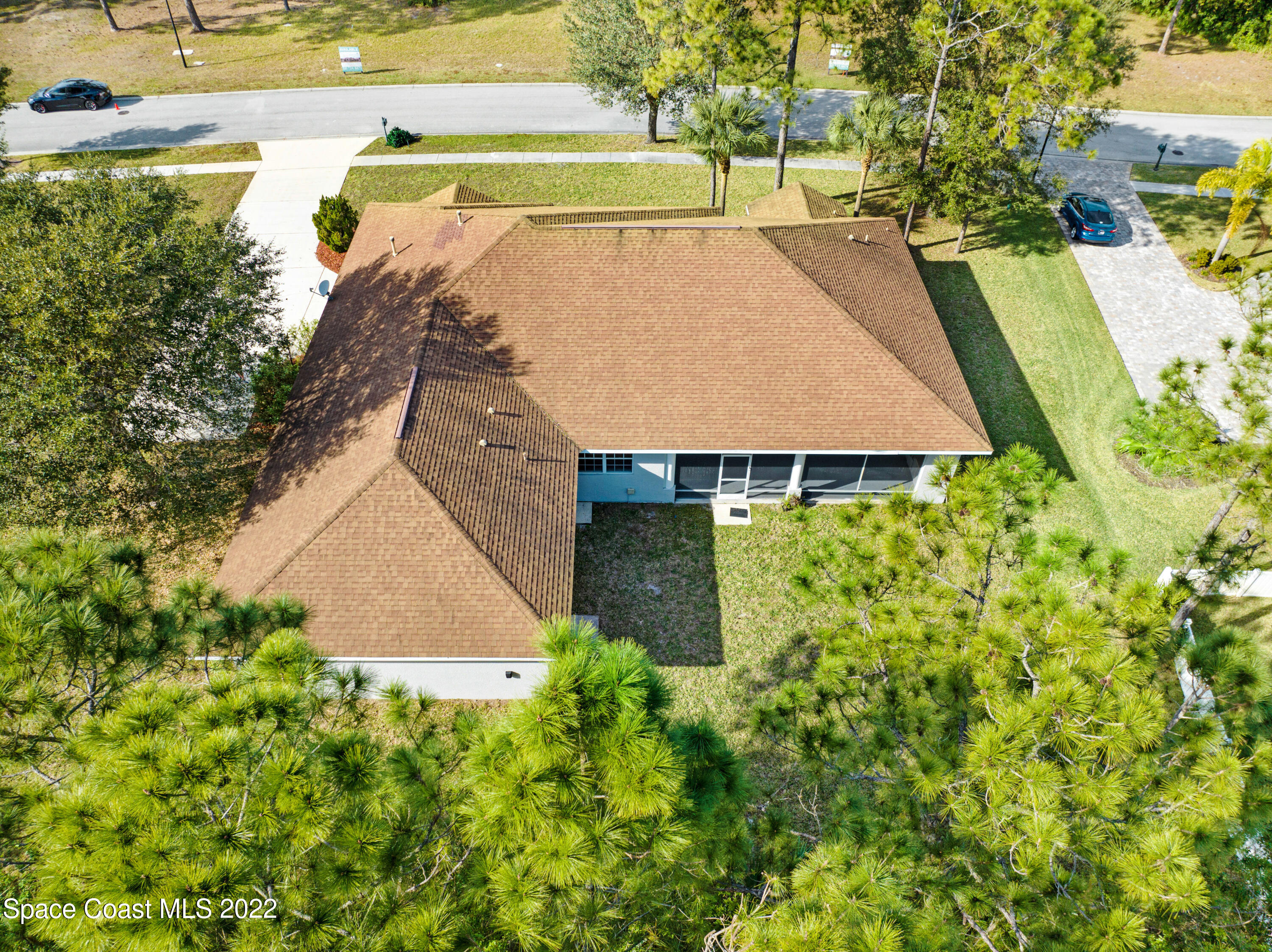 2185 Windbrook Drive Palm Bay, FL 32909 - Photo 6 of 61 a view of a swimming pool with an outdoor space and seating area